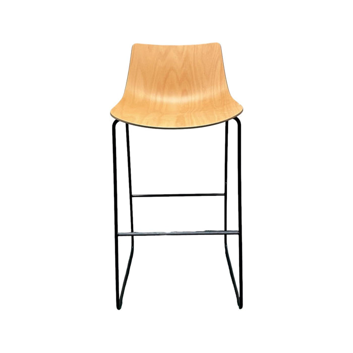 Allermuir wooden bar stool with slightly curved shell and black metal legs, from the front.
