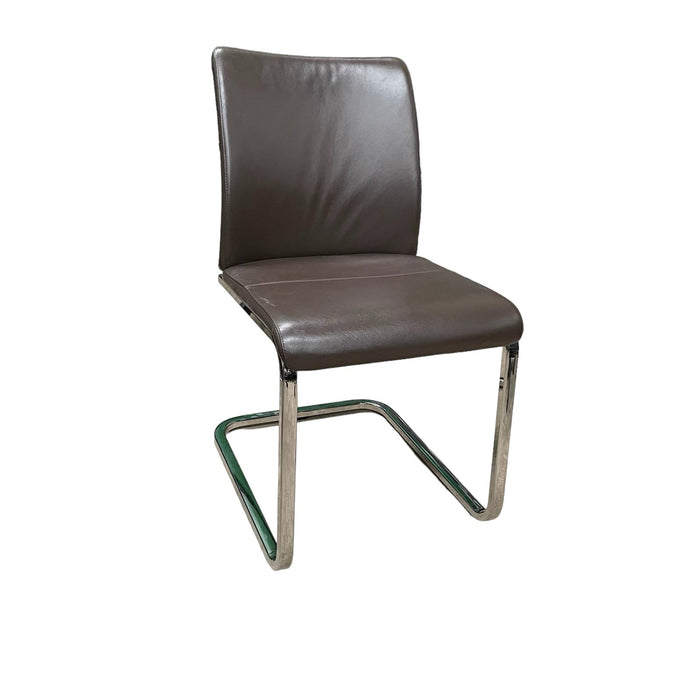 Steelcase brown leather office chair with chrome cantilever base, from the side.