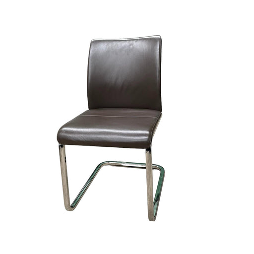 Steelcase brown leather office chair with chrome cantilever base, from the side.