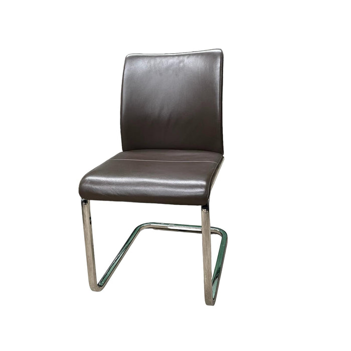 Steelcase brown leather office chair with chrome cantilever base, from the side.