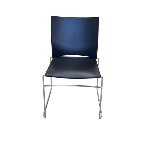 Xpresso black stacking chair with metal legs, from the front.