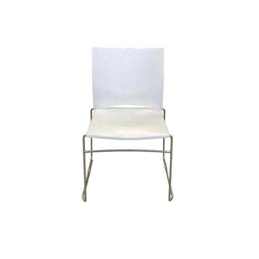 White Xpresso stacking chair with metal legs, from the front.