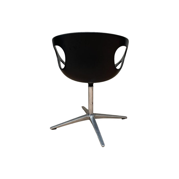 Red and black Fritz Hansen swivel dining chair.