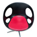 Red and black Fritz Hansen swivel dining chair.