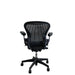 Product image of the back of a graphite Herman Miller mesh office chair.
