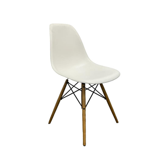 White Vitra DSW eames chair with wooden legs.