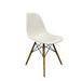 White Vitra DSW eames chair with wooden legs.
