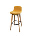 Upholstered yellow bar stools with wooden legs and footrest from the side.
